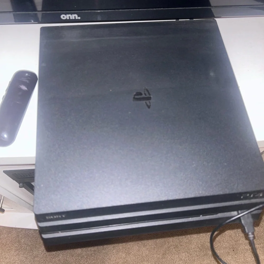 Sony PlayStation 4 Pro Console - Sleek Black Design